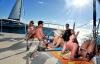 Sunbathing on a catamaran Croisière Oc�ane